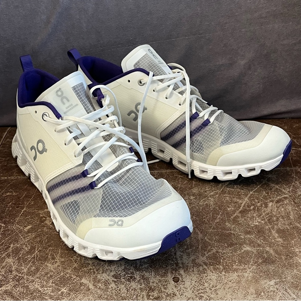 On Running White and Purple Athletic Shoes